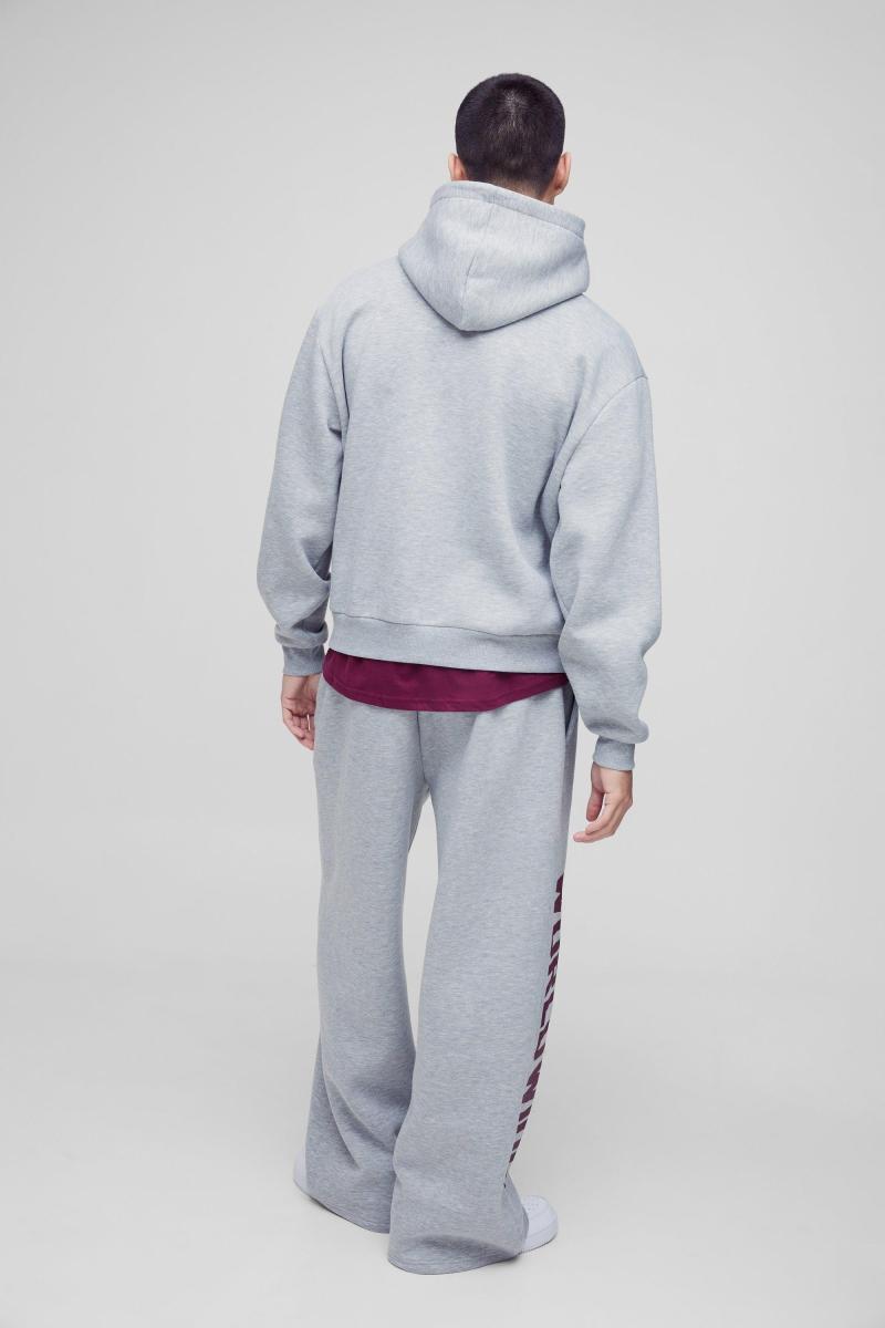 Величезний спортивний костюм з капюшоном і принтом у всьому світі