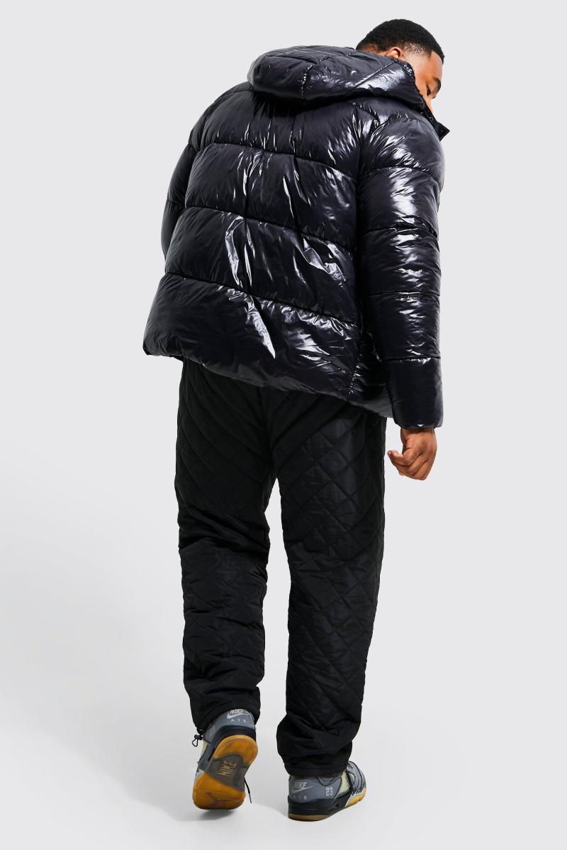 Плюс блискуча куртка-пуховик чорного кольору
