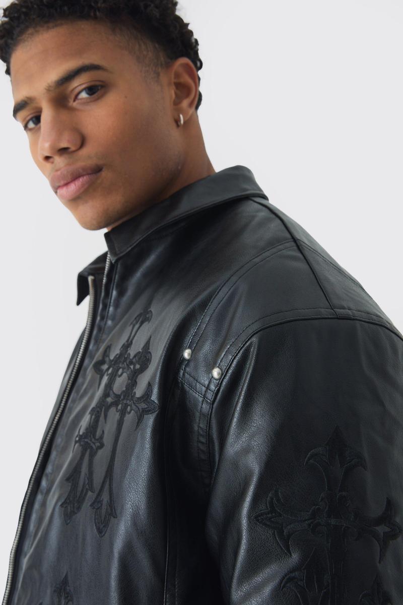 Чорна поліуретанова косуха з хрестовою аплікацією